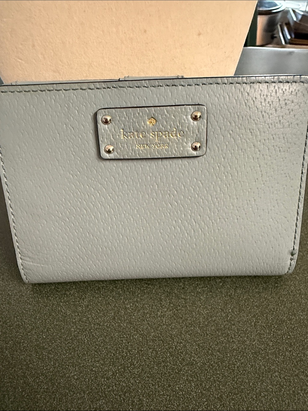 kate spade Light Gray Pebbled Leather Wallet with Gold Plaque